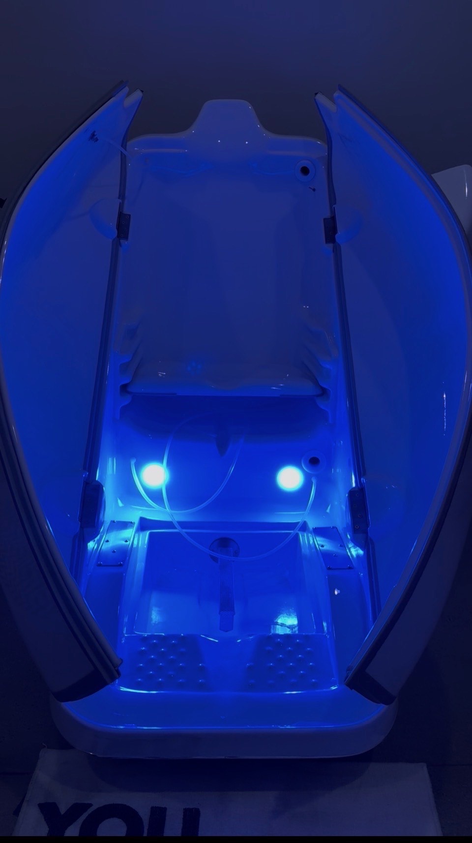 Inside SOZO's HOCATT chamber, glowing blue with photon light